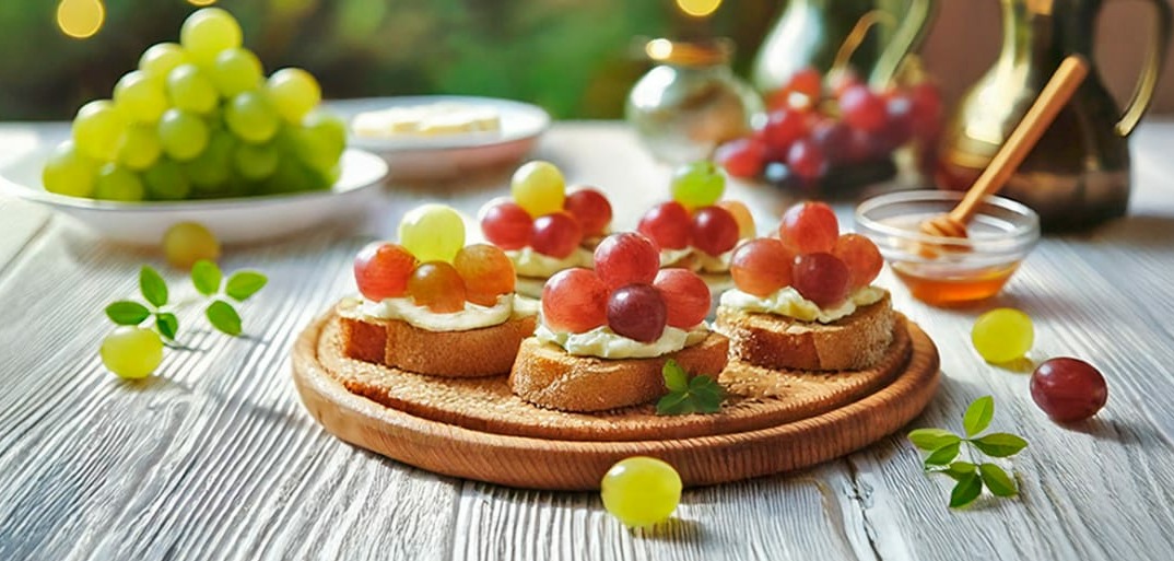 Roasted grape crostini with creamy cheese and herbs – a gourmet appetizer with a sweet and savory twist.