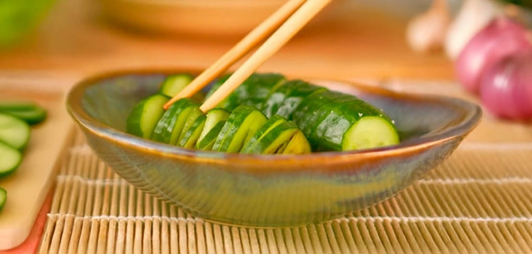 Accordion cucumber salad with fresh cucumbers, herbs, and a light dressing, elegantly arranged for a refreshing dish.