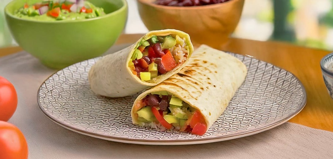 Veggie Burrito – tortilla filled with fresh vegetables, black beans, rice, and avocado salsa.